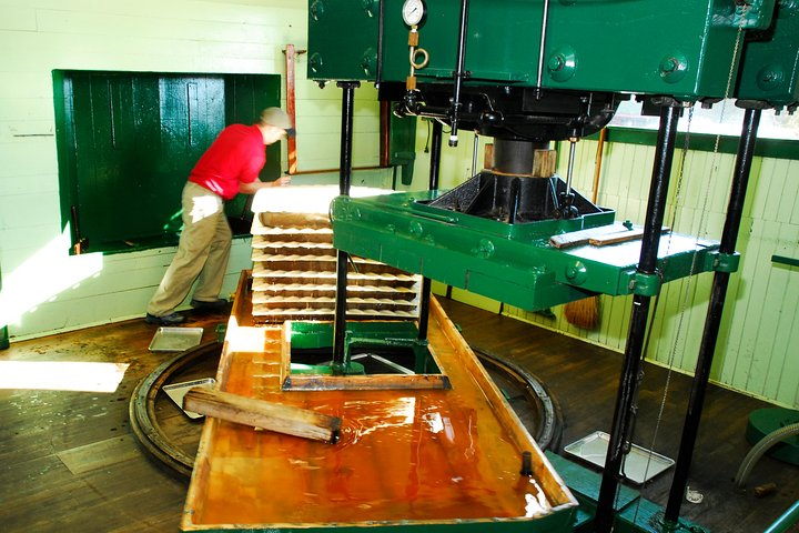 1889 water-powered press in actions on Fall weekends.